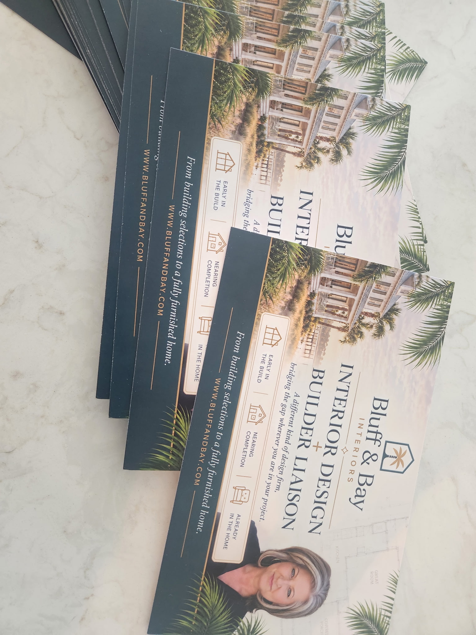 Actual Bluff & Bay printed marketing materials with the brand, services, website and owner Kary Gregor